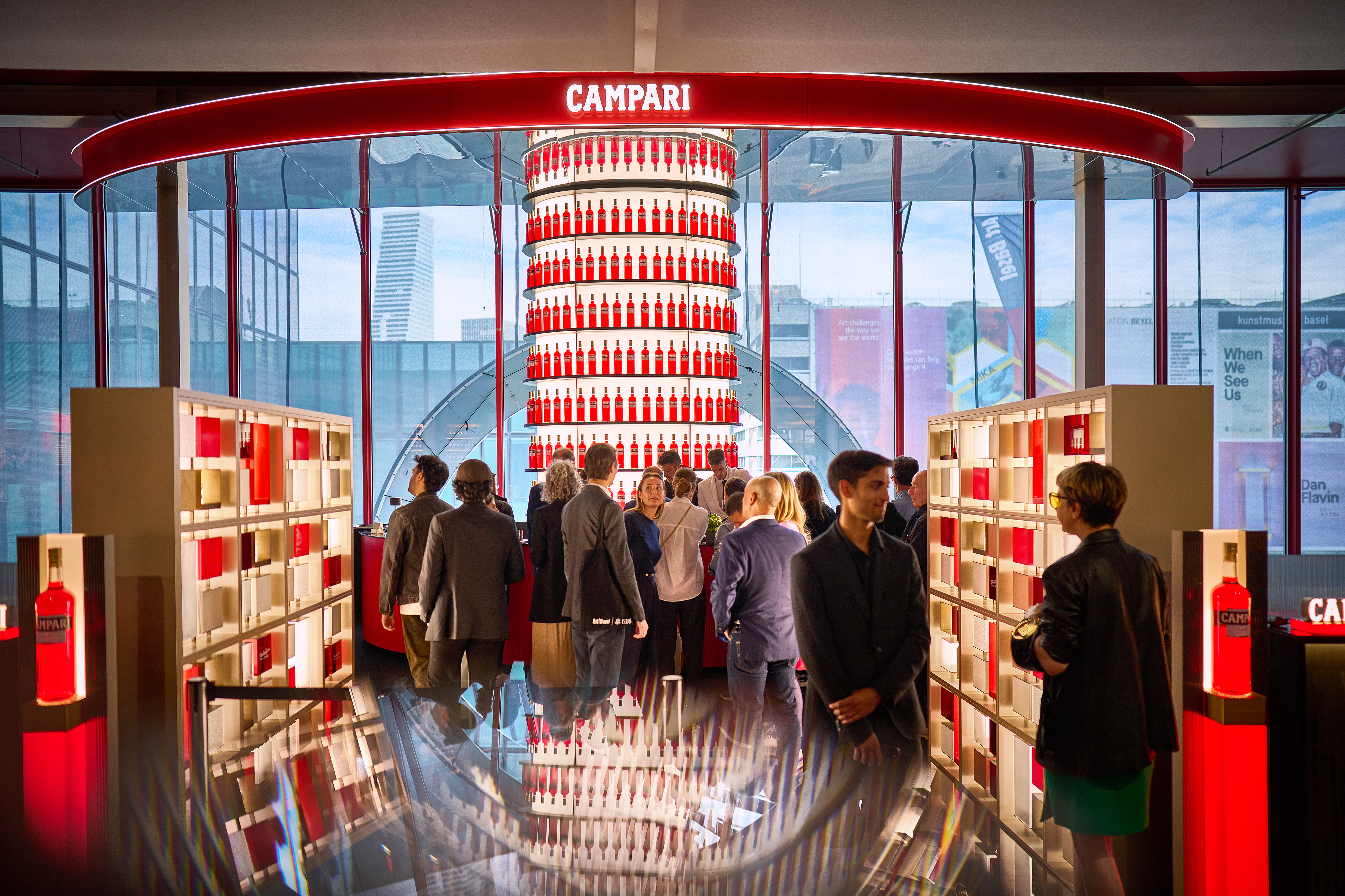 Campari - a red bar with people around and Campari bottles everywhere