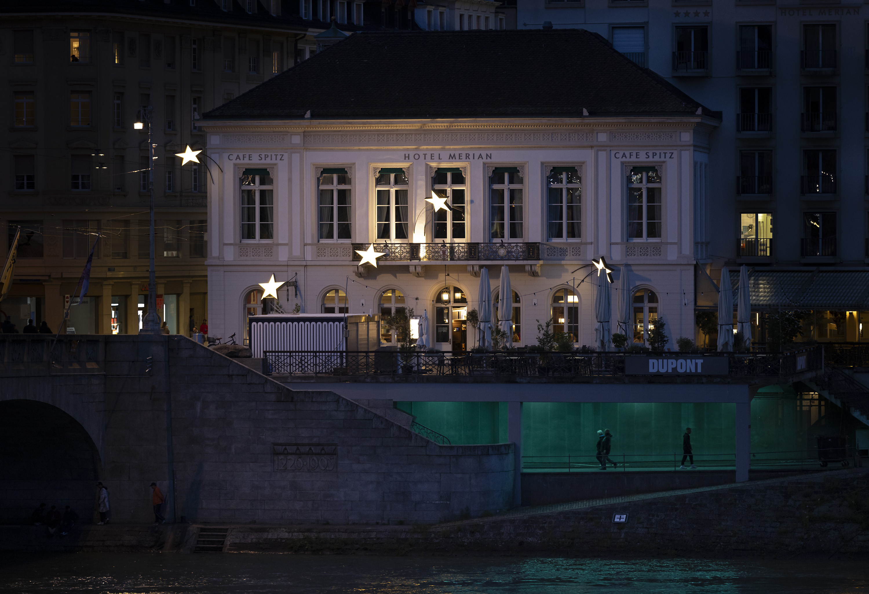 Petrit Halilaj - a Grand Hotel with large stars sprawled across its exterior at night