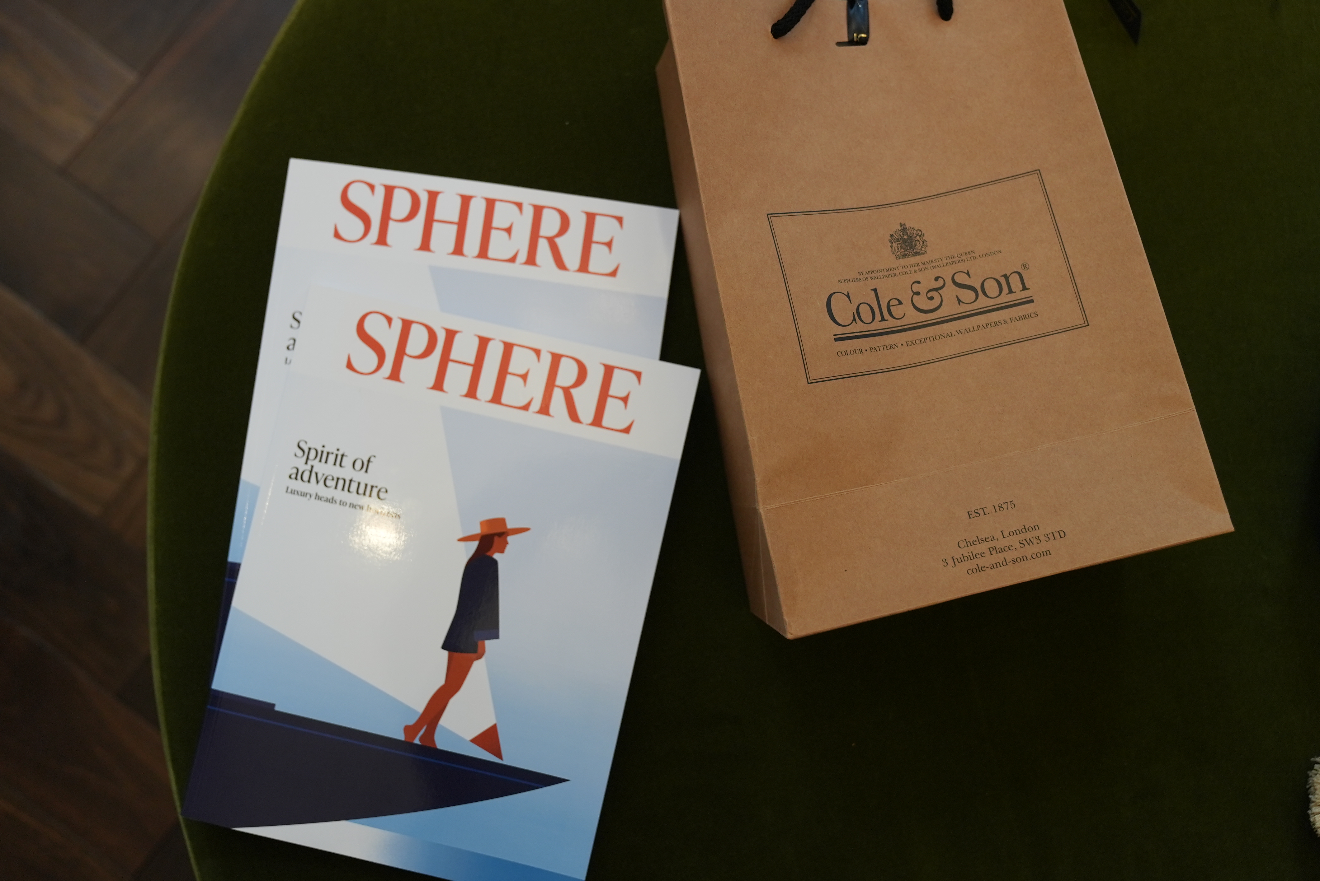 Cole & Son - sphere magazine next to a Cole & Son bag