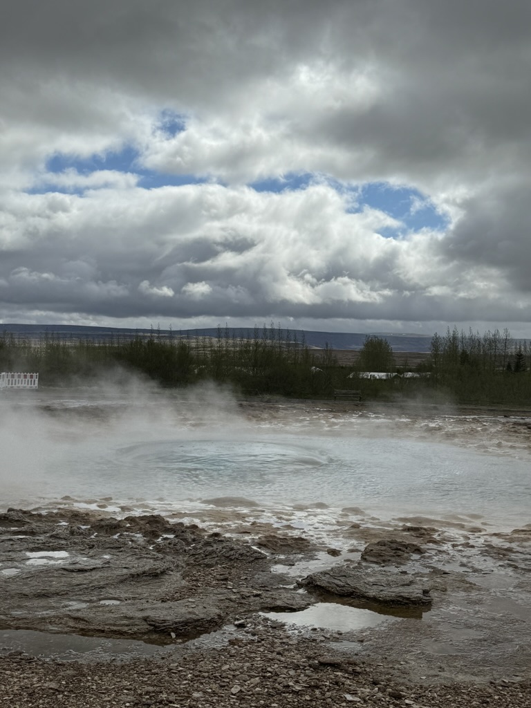 Strokkur - a hot spring about to erupt 