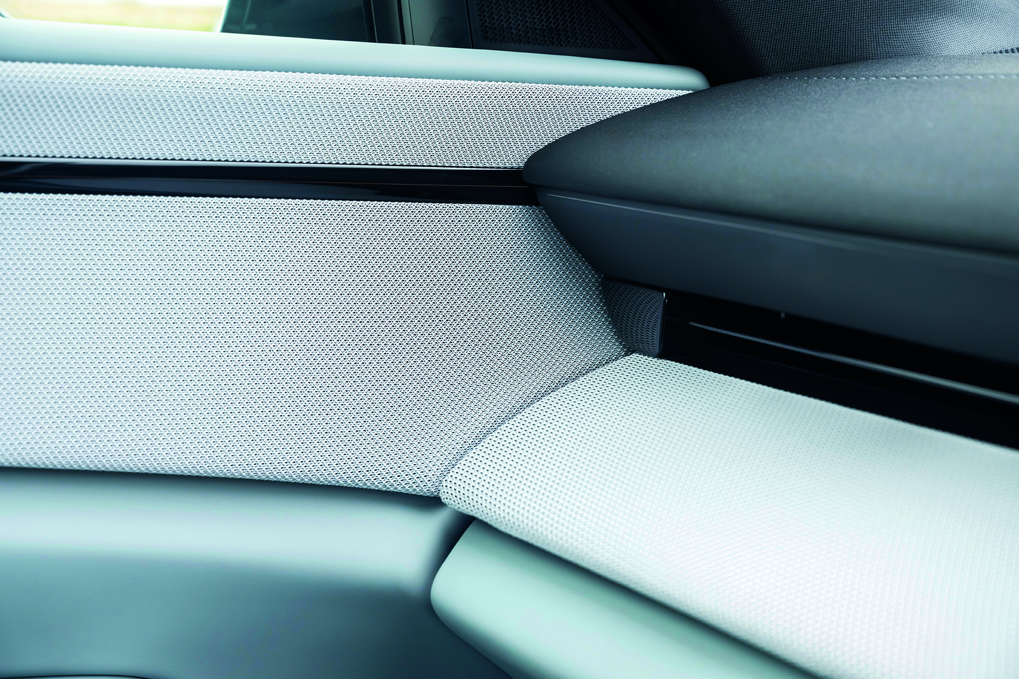 Investment, Tech & Motoring trends 2025 - Up close image of Polestar fabric on the interior of a car with a knit like finish in a grey colour way