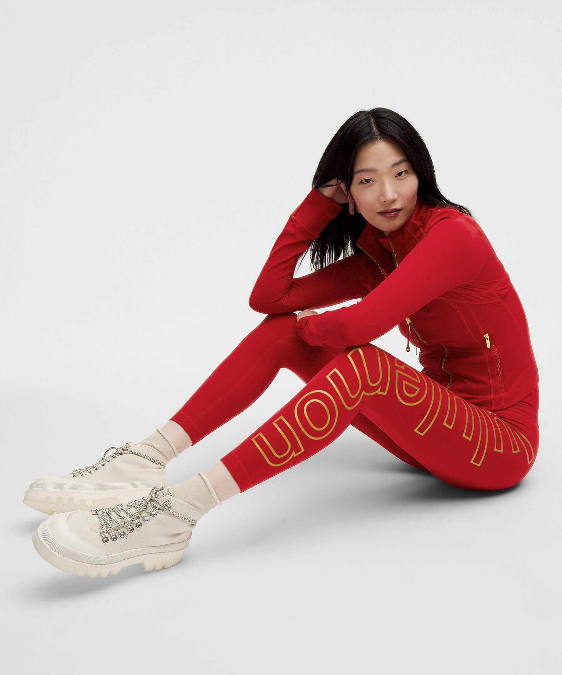 Luxury Chinese New Year of the Snake - model wearing the Lululemon lunar new year sports jacket and leggings 