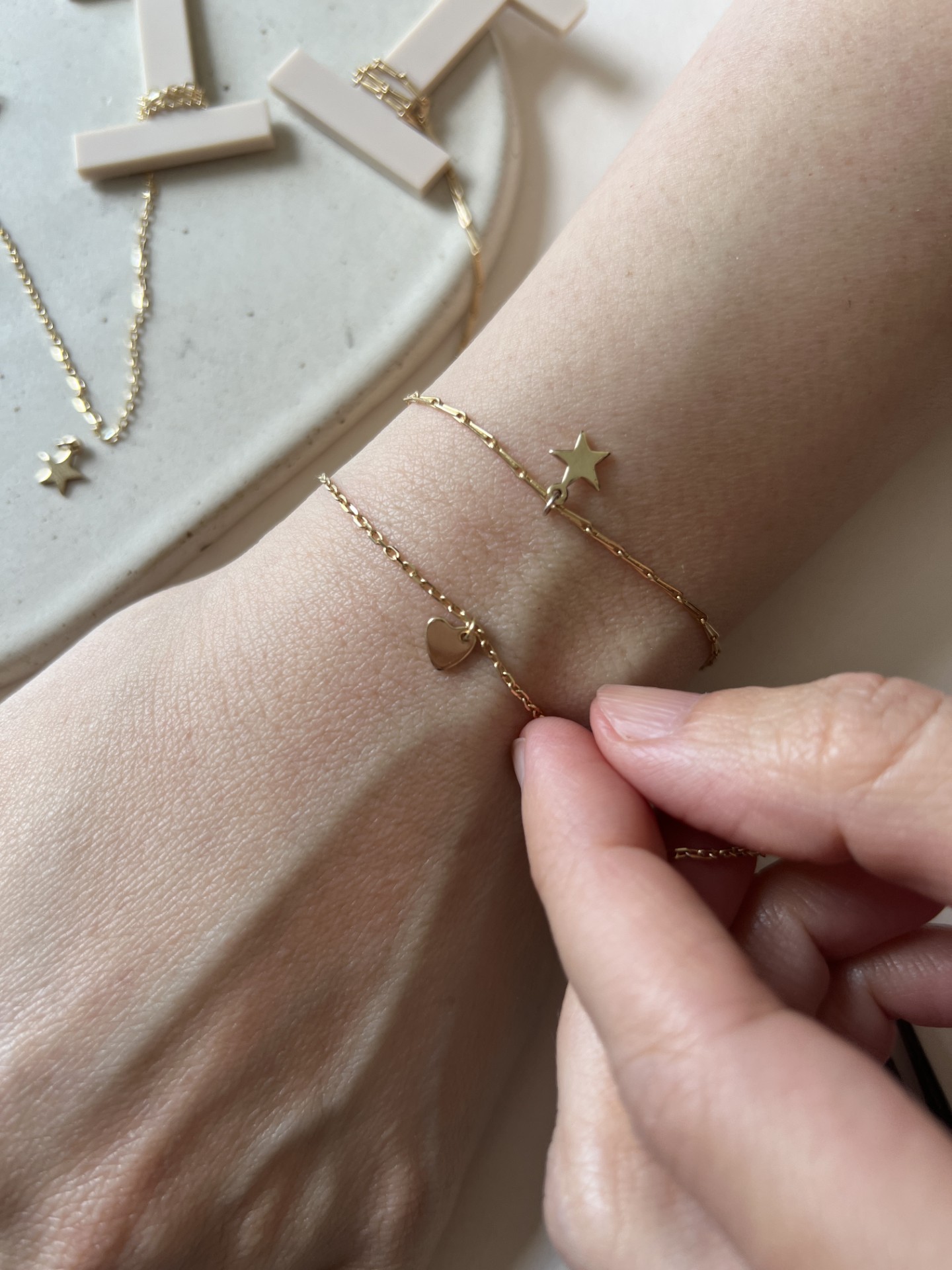 Alternative Valentine's Day London Experiences - a permanent bracelet with gold heart and star charms