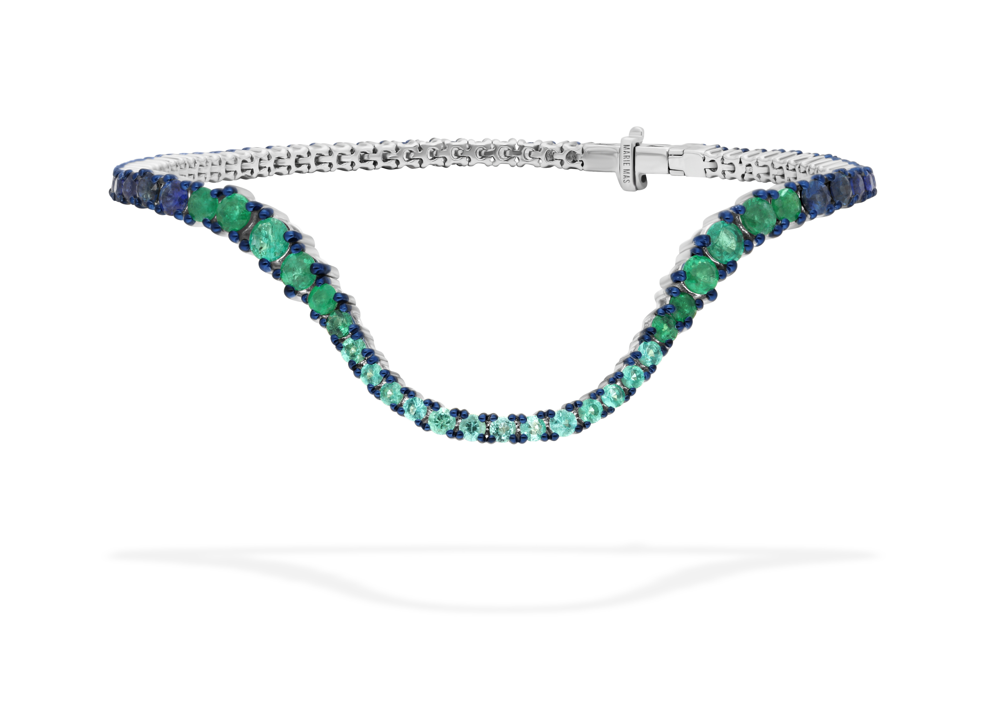 Bracelet Stacks - a white gold Marie Mas bracelet with a wave-like design, featuring a gradient of emeralds and sapphires