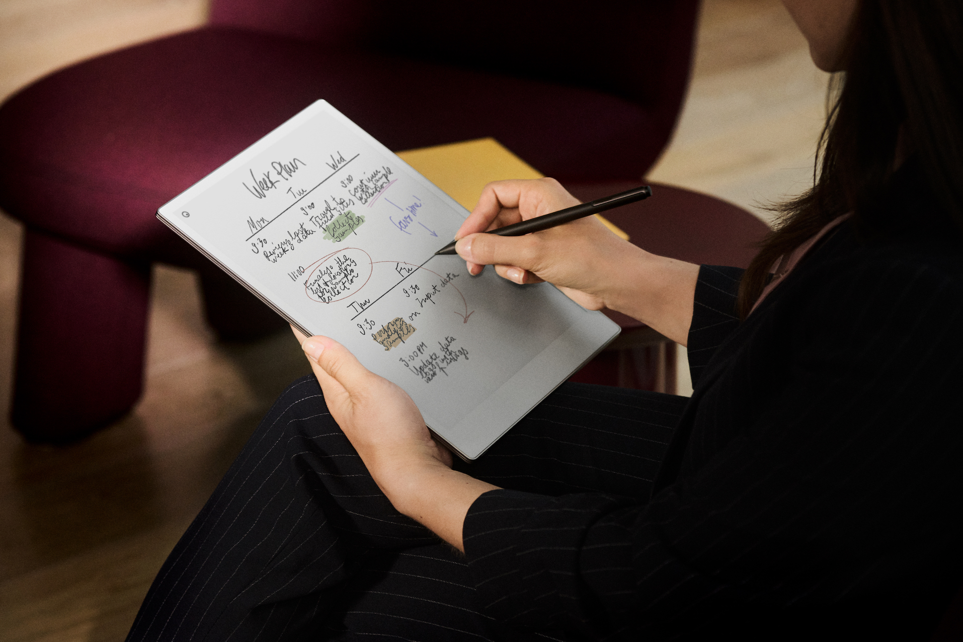 Investment, Tech & Motoring trends 2025 - A person using a digital tablet to organise a weekly plan with a stylus. The screen displays handwritten notes and schedules in multiple colours, showcasing an intuitive and paper-like interface