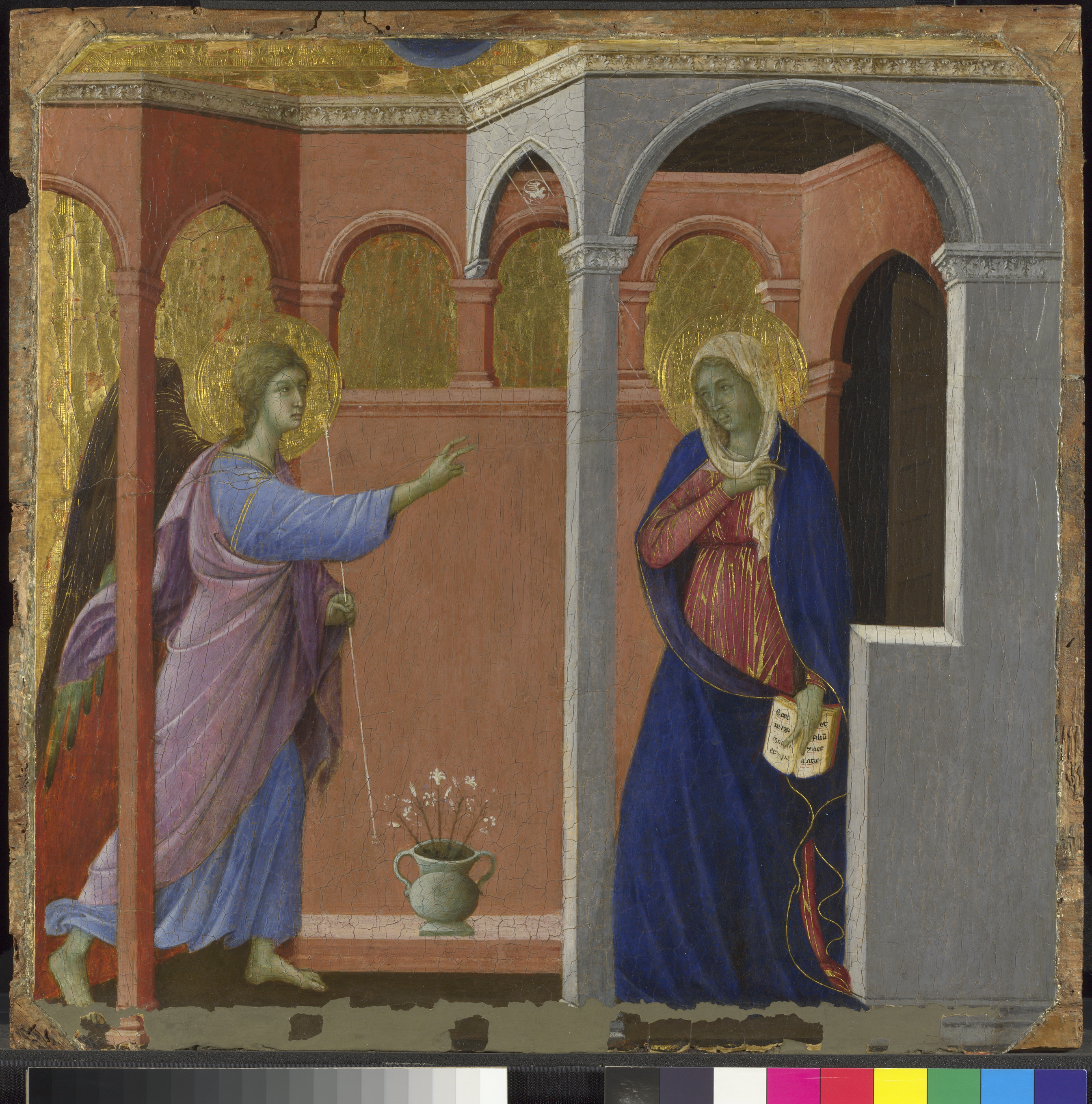 Siena at The National Gallery - The annunciation part of the Maestà panels by Duccio depicting the annunciation. This image shows the Angel Gabriel speaking to the Virgin Mary set in a room with arches.